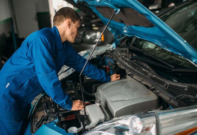 mechanic-repairs-car-engine-motor-diagnostic-small